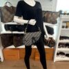 Saddle bag carried by a mannequin in the boutique