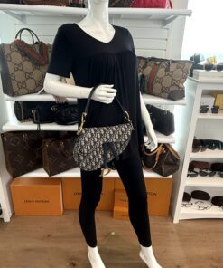 Saddle bag carried by a mannequin in the boutique