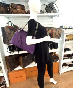 Soho chain bag carried by a mannequin in the boutique