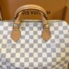 Speedy 30 in its Louis Vuitton box seen from above, handles upright