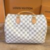 Front of the Speedy 30 with Louis Vuitton boxes behind it