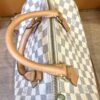 Detail of the vachetta handles where they meet the zip