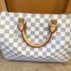 Angled front view showing the Damier Azur check and handles