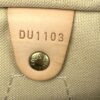 Date code DU1103 stamped on the leather tab beside the press stud