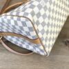 Base of the bag with the shoulder strap laid across