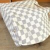 Underside and lower panel of the Damier Azur canvas