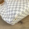 Side of the bag showing the canvas and trim