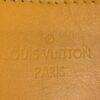 Embossed stamp on the mustard yellow leather trim