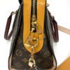 End view with the brass strap clasp