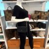 Mannequin carrying the pochette on the chain strap