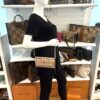 Wallet on chain worn by a mannequin in the boutique