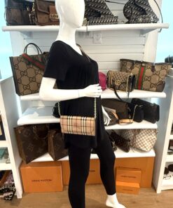 Wallet on chain worn by a mannequin in the boutique