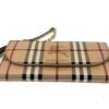 Front of the wallet laid flat with the chain beside it