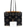 Tote photographed with its information card