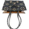 Top of the tote with the handles standing, black side