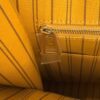 Interior zip pocket set into the striped lining
