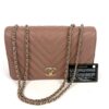 Bag shown with its black Chanel authenticity card