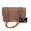 Bag with its authenticity card and Chanel tag