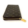 Angled view showing the gold zip pull and Monogram canvas