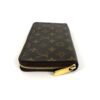 Side of the closed wallet with the gold zip pull