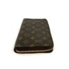 Wallet standing to show the Monogram canvas front