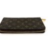 Closed wallet laid flat showing the zip along the edge