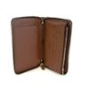 Wallet open showing the card slots and brown leather interior