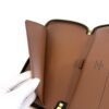 Wallet held open showing the interior compartments