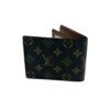 Closed wallet at an angle across the Monogram canvas