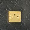 Reverse of the gold lock plate inside the flap