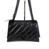 Front view with the doubled chain strap raised and the retail tag attached