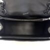 Overhead view into the open top showing the black leather interior