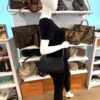 the crossbody worn on the shoulder in the showroom
