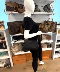 the crossbody worn on the shoulder in the showroom