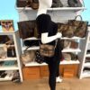 the bag on a mannequin in the showroom, side view