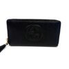Gucci Soho zip around wallet in black pebbled calfskin with an embossed interlocking G and gold tassel zip pull