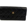Chanel large gusset flap wallet in black diamond quilted caviar leather with a polished gold CC on the front flap