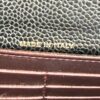close up of the caviar grain beside the burgundy interior edge