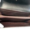 interior open showing the burgundy card slots and bill compartment