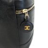 Side view showing the gold zipper and CC zip pull medallion