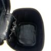 Opened case showing the stamped strap and interior pocket