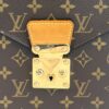 Close up of the brass push lock and vachetta tab on the front flap