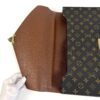 Flap opened flat, showing the tan leather lining