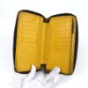 Interior card slots held open in a gloved hand