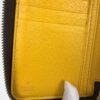 Close up of the card slots in yellow leather