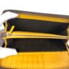 Center zip pocket unzipped between the compartments