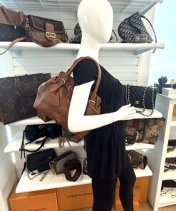 The tote carried on the arm of a mannequin