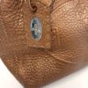 Side hang tag with the oval logo plate