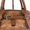 Front detail with belt buckle and embossing