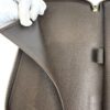 Large gusseted compartment held open by a gloved hand